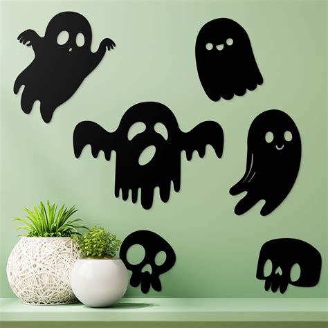 Halloweenska výzdoba tekvicou a netopierom
