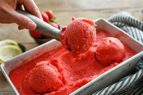 Fresh strawberries and lemons prepared for making sorbet