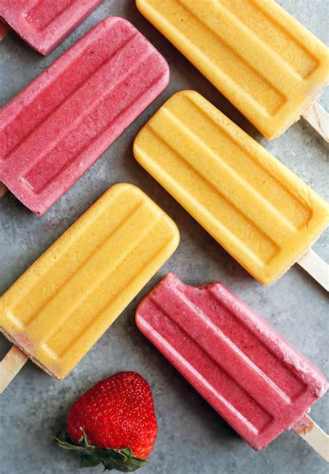 Colorful vegan popsicles and ice cream in decorative glasses