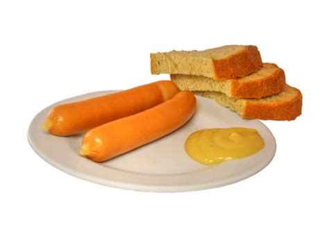 párky s horčicou a chlebom na tanieri