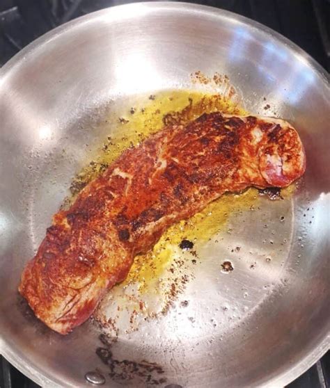 Searing pork tenderloin in a hot pan