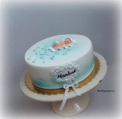 Torta na krst pre chlapca s modrými dekoráciami a detskými motívmi