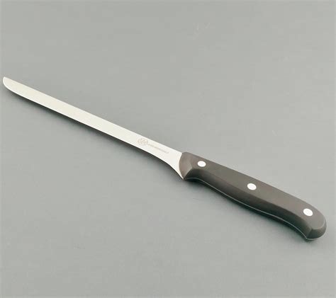 Long, thin blade of a ham knife